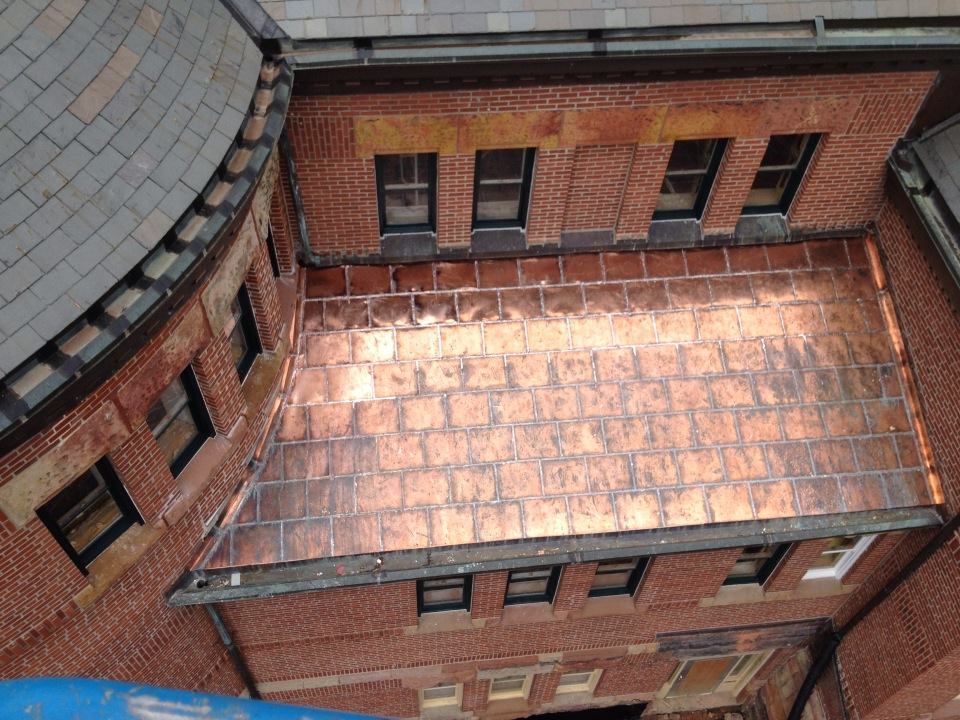 Copper standing seam roofing atop high-temp underlayment