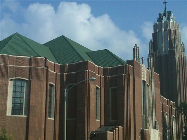 Expert Skylight Installation on EPDM Roof | Commercial Roofing Solutions Durable green clay tile roof installed by Kreiling at Trinity Church in Bloomington, IL