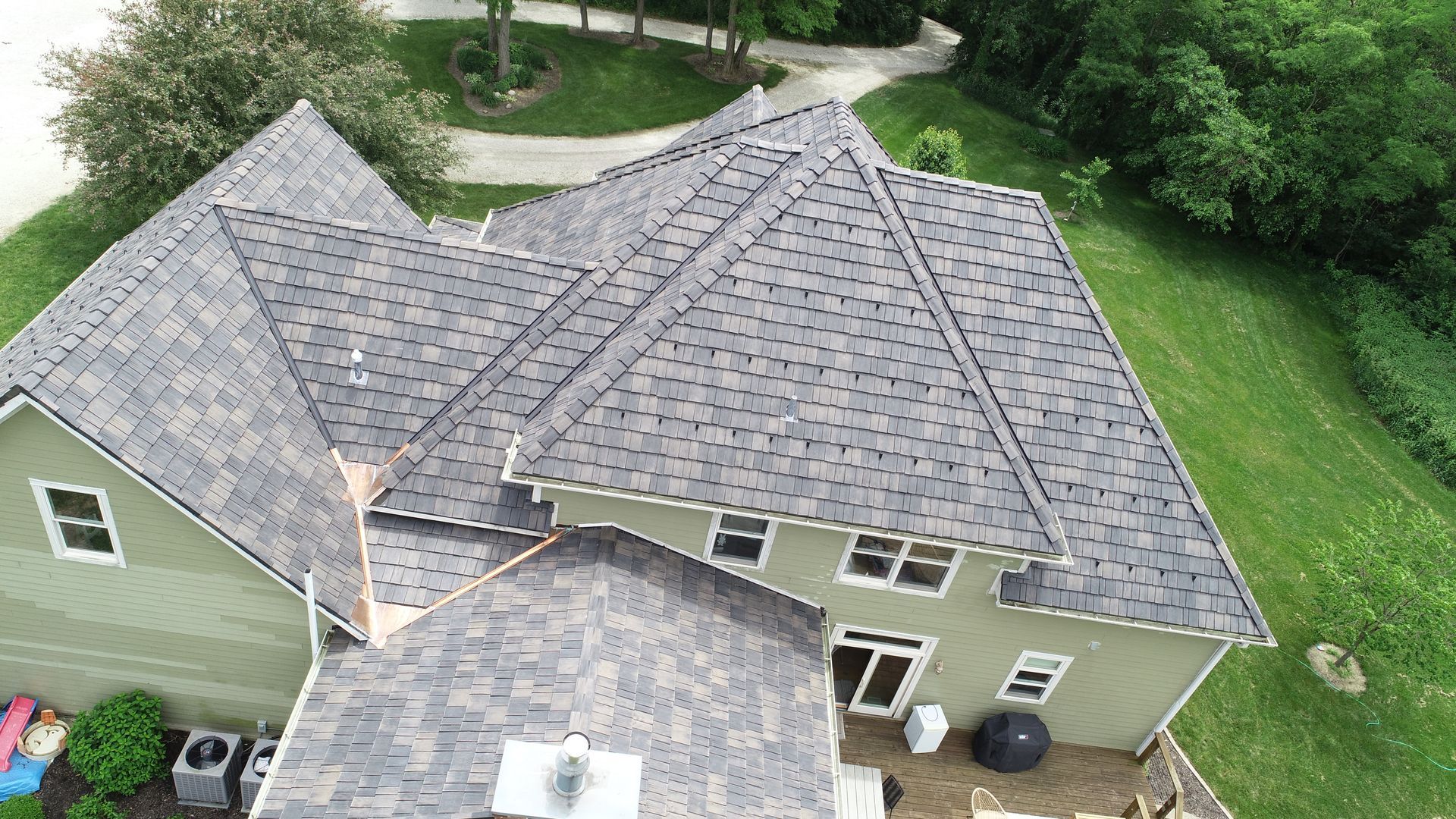 Synthetic roofing materials mimicking natural textures.