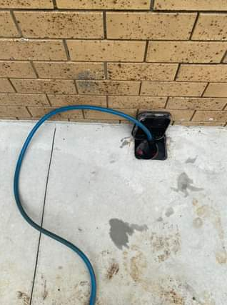 A Reticulation pump set up outside a brick house — Allied Pest Management Northern Rivers in Tregeagle, NSW
