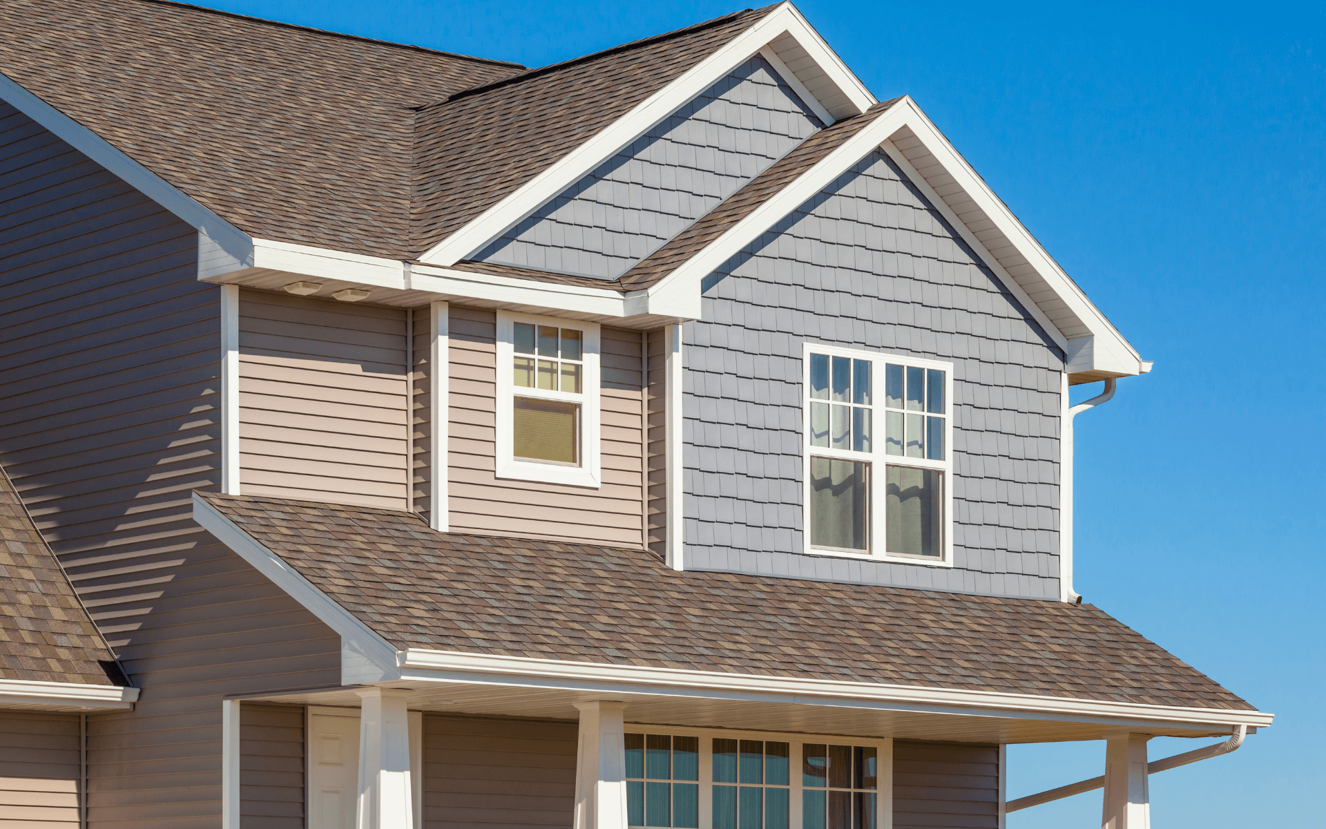 A house with a brown roof and a lot of windows