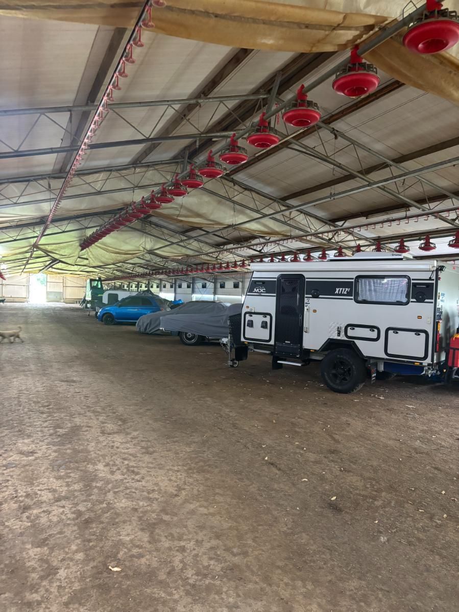 A Row Of Trailers Are Parked Inside Of A Building — Byron Storage Services In Myocum, NSW