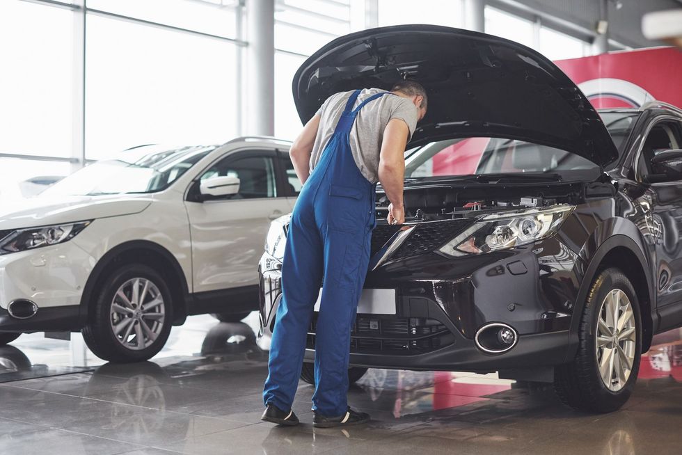 Well-maintained vehicle being serviced by a mobile mechanic.