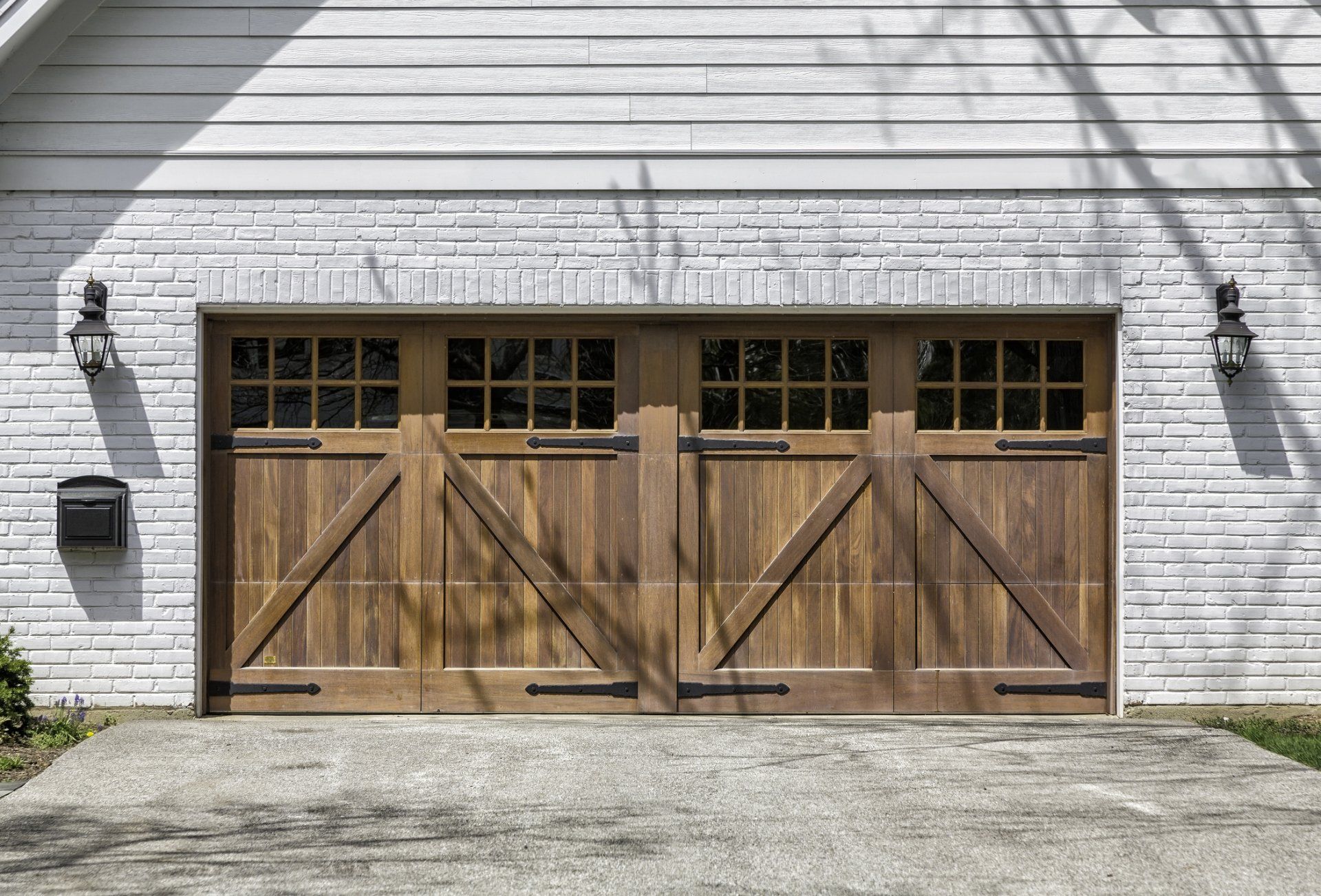 New garage door installation of double wide wood doors