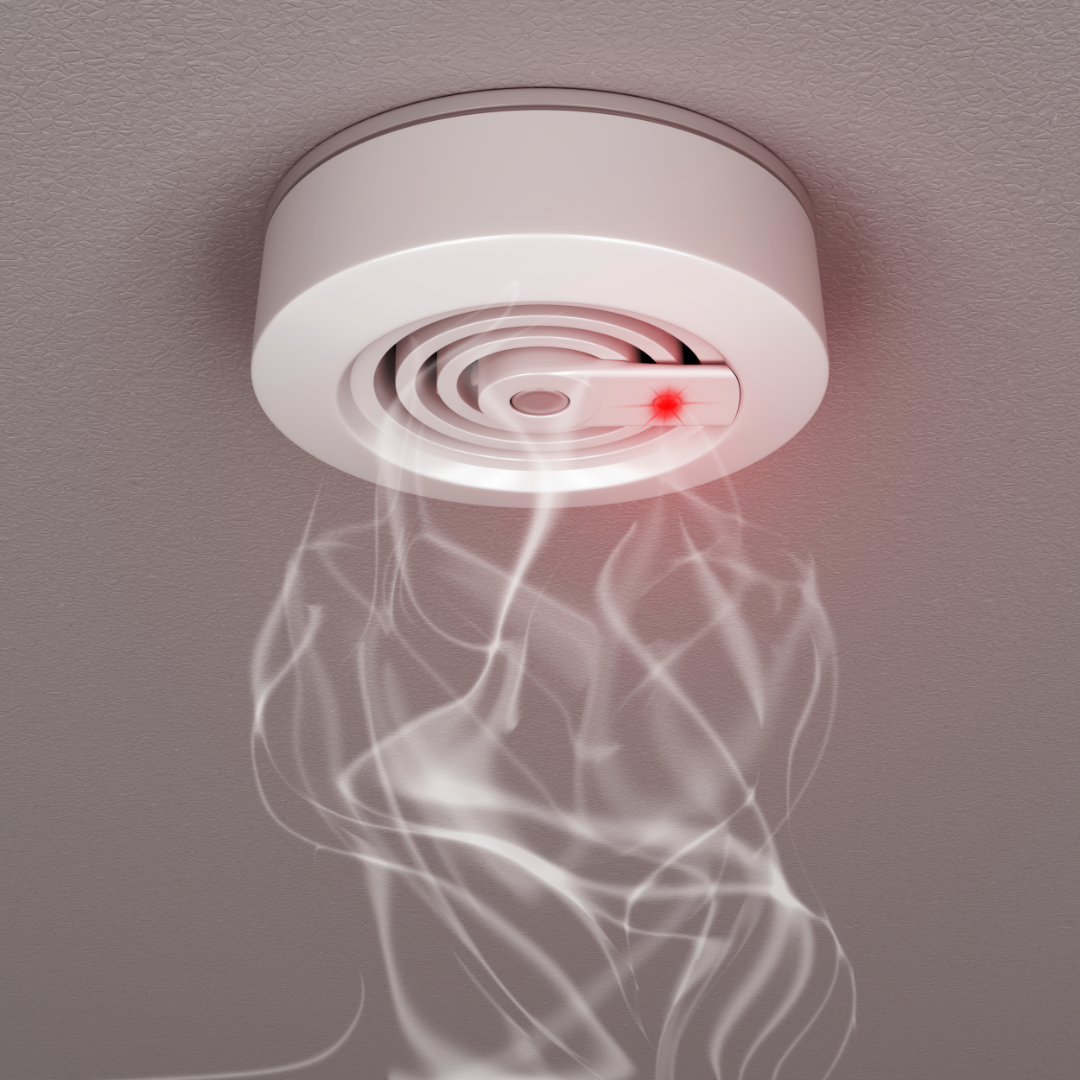 A smoke detector with smoke coming out of it