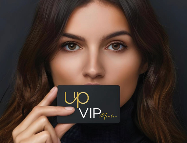 Woman holding a black VIP card that says 