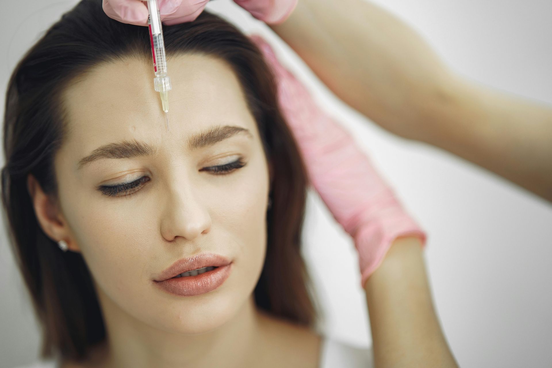A woman with smooth, healthy skin showing the benefits of preventative aesthetics.