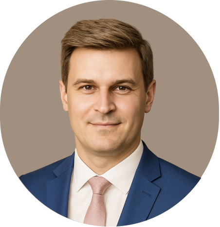 A headshot of a person wearing a blue suit, white shirt, and pink tie against a neutral brown background.