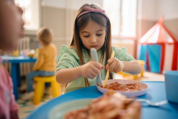 Baby Girl Eating — Register, GA — Bright Minds Playhouse