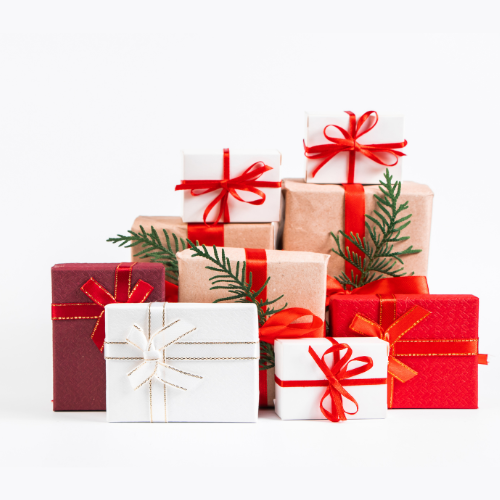 Stack of wrapped gifts, various colors, with red bows and greenery against a white background.