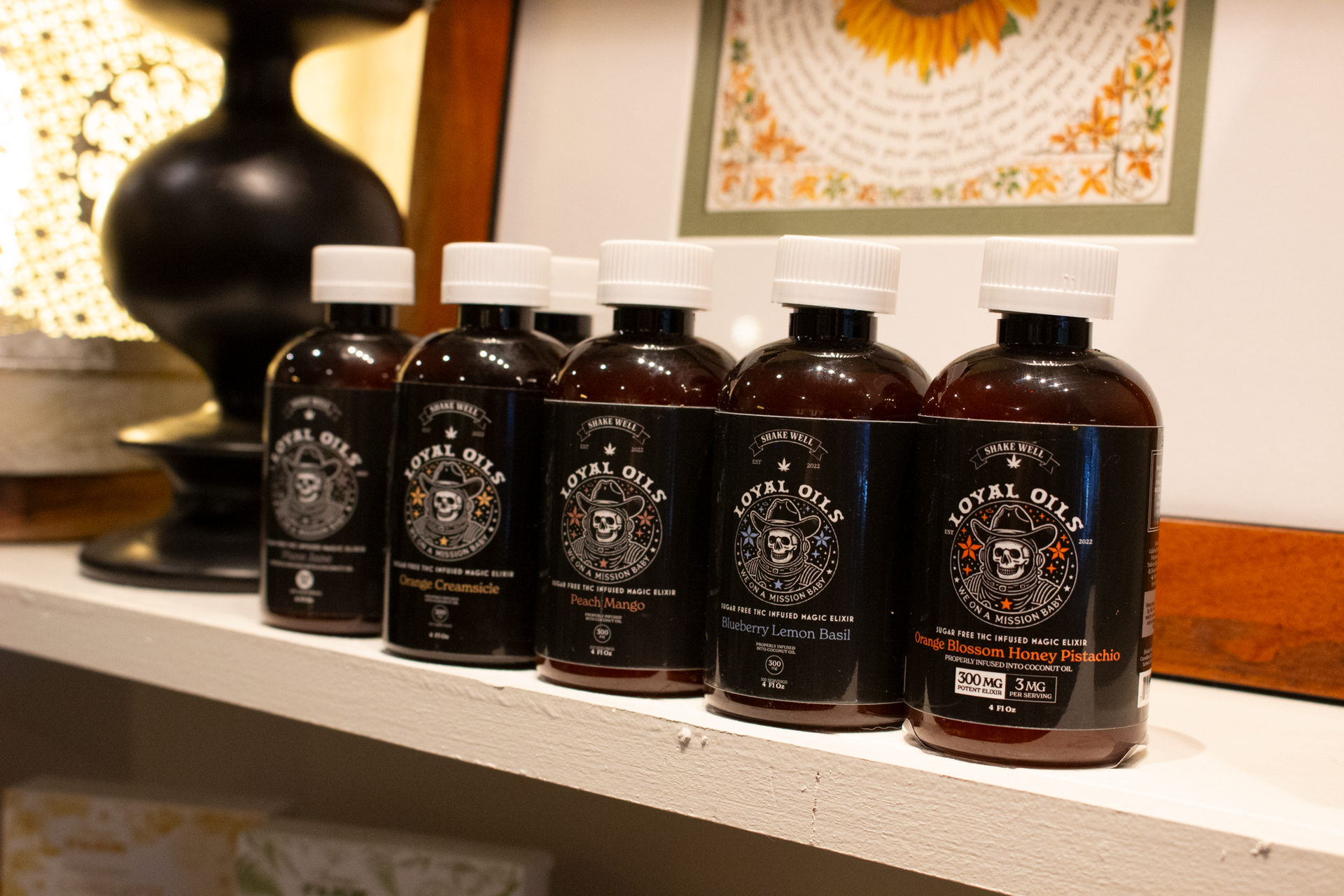 5 bottles varying flavors of of loyal oils THC infused syrups