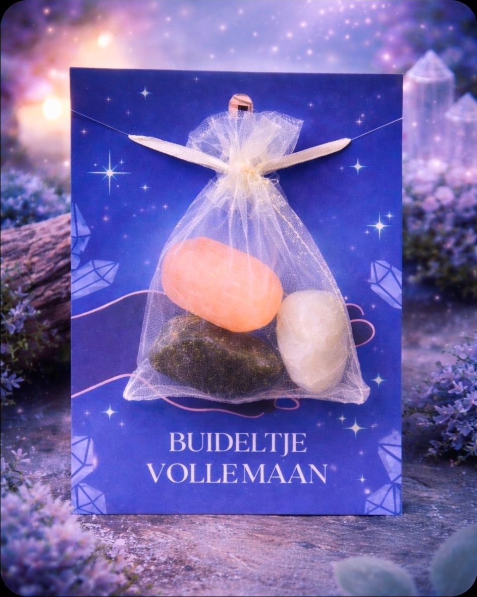 Een transparant engeltje met roze en witte steentjes op een blauw