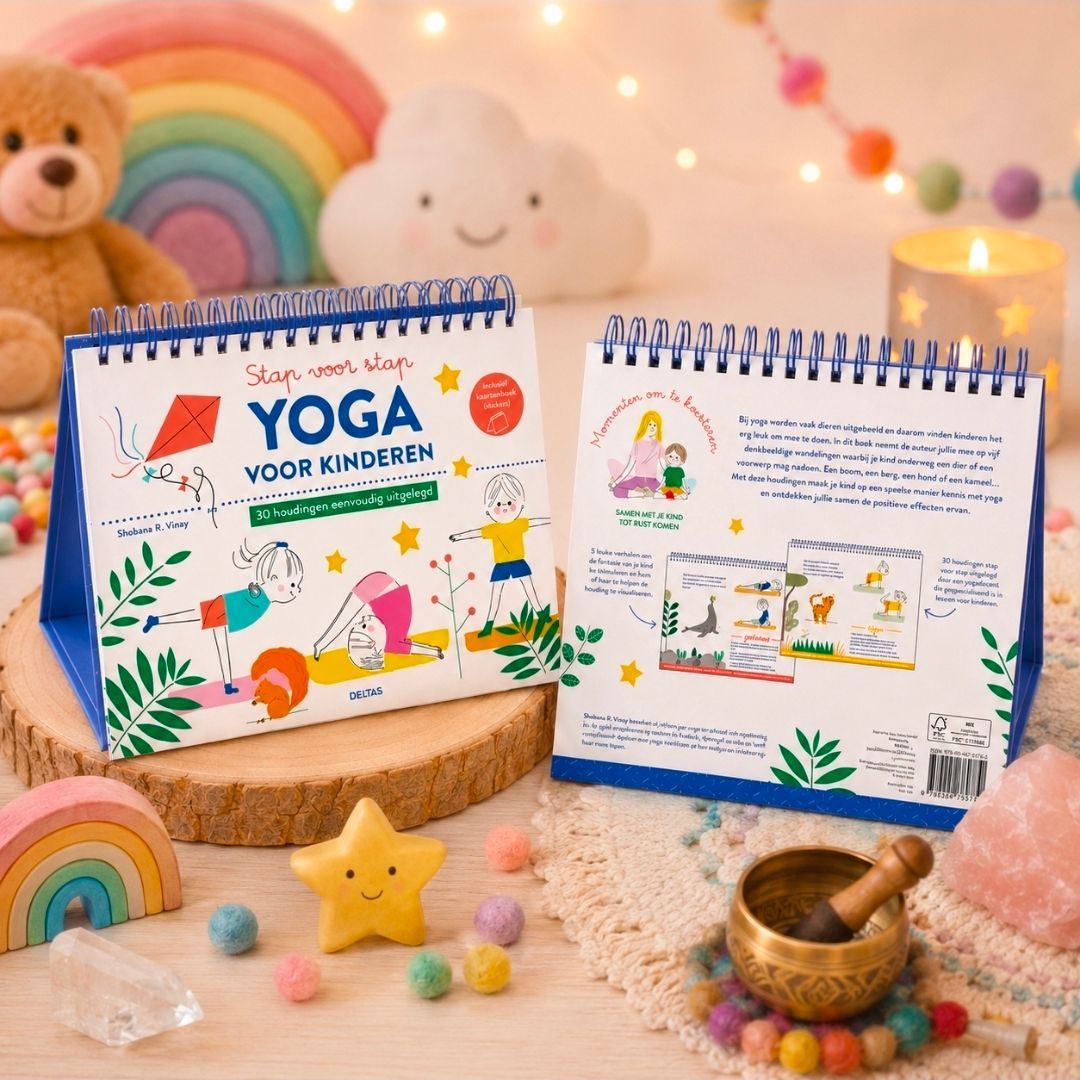 Kinderyogaboeken op een gezellig pastelkleurig display met regenboogdecoratie en een klankschaal.