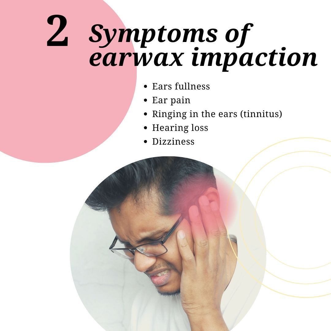 A man with glasses is holding his ear in pain