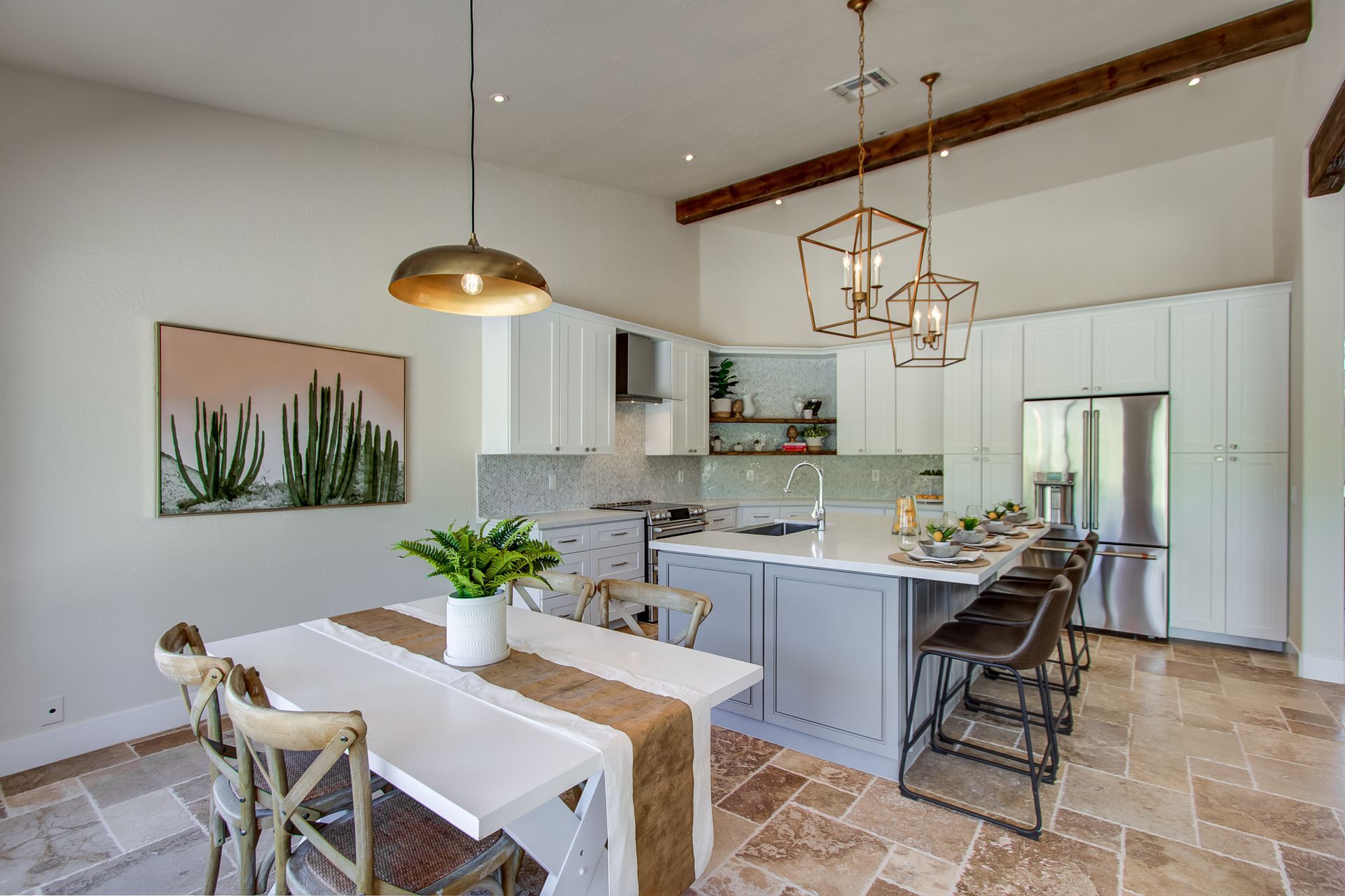 A kitchen with a table and chairs in it