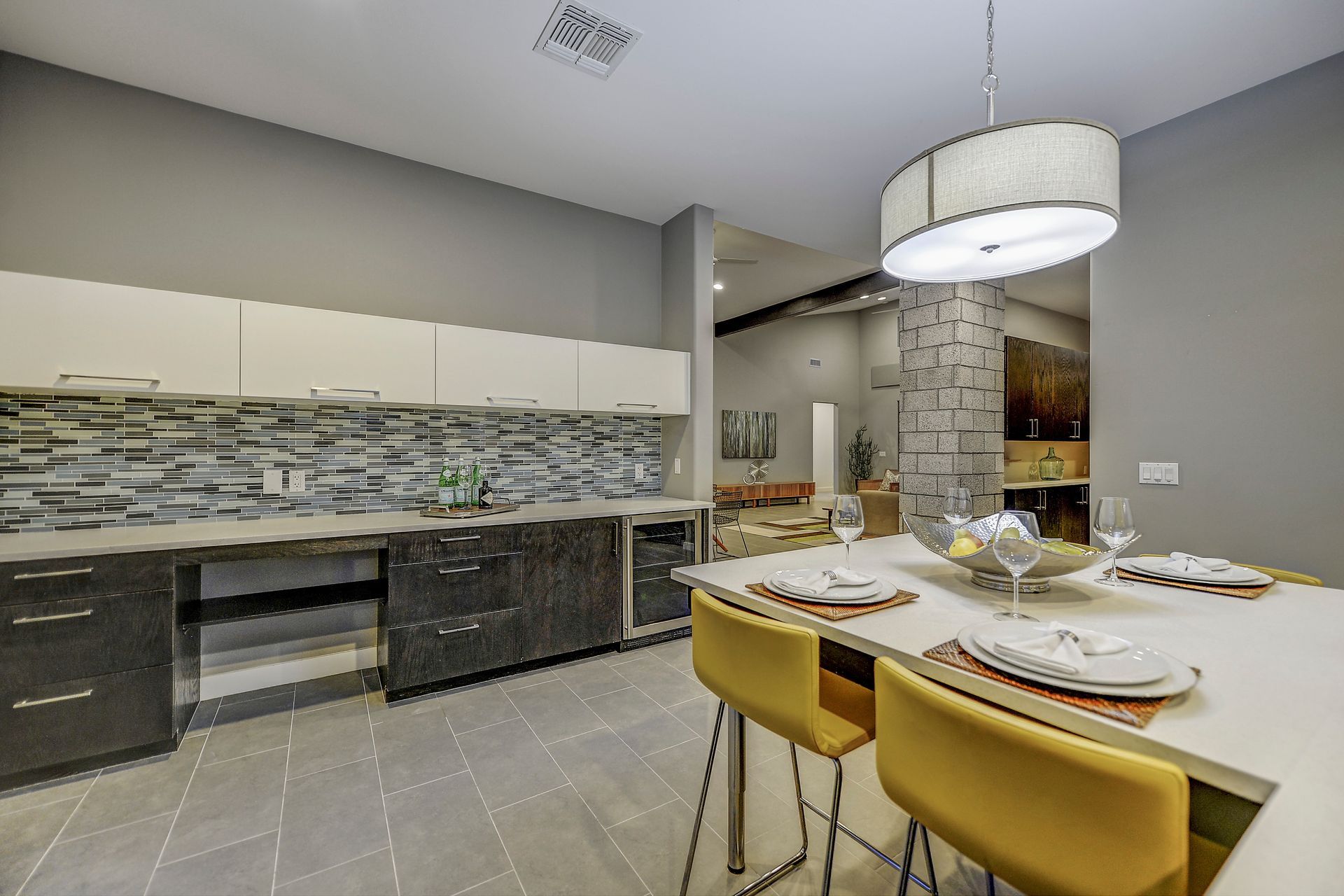 A kitchen with a table and chairs in it