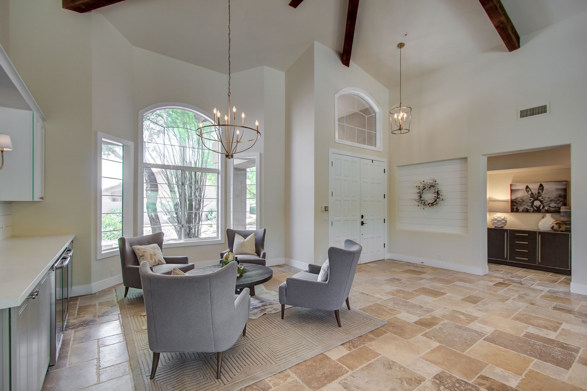 A living room with two chairs and a table