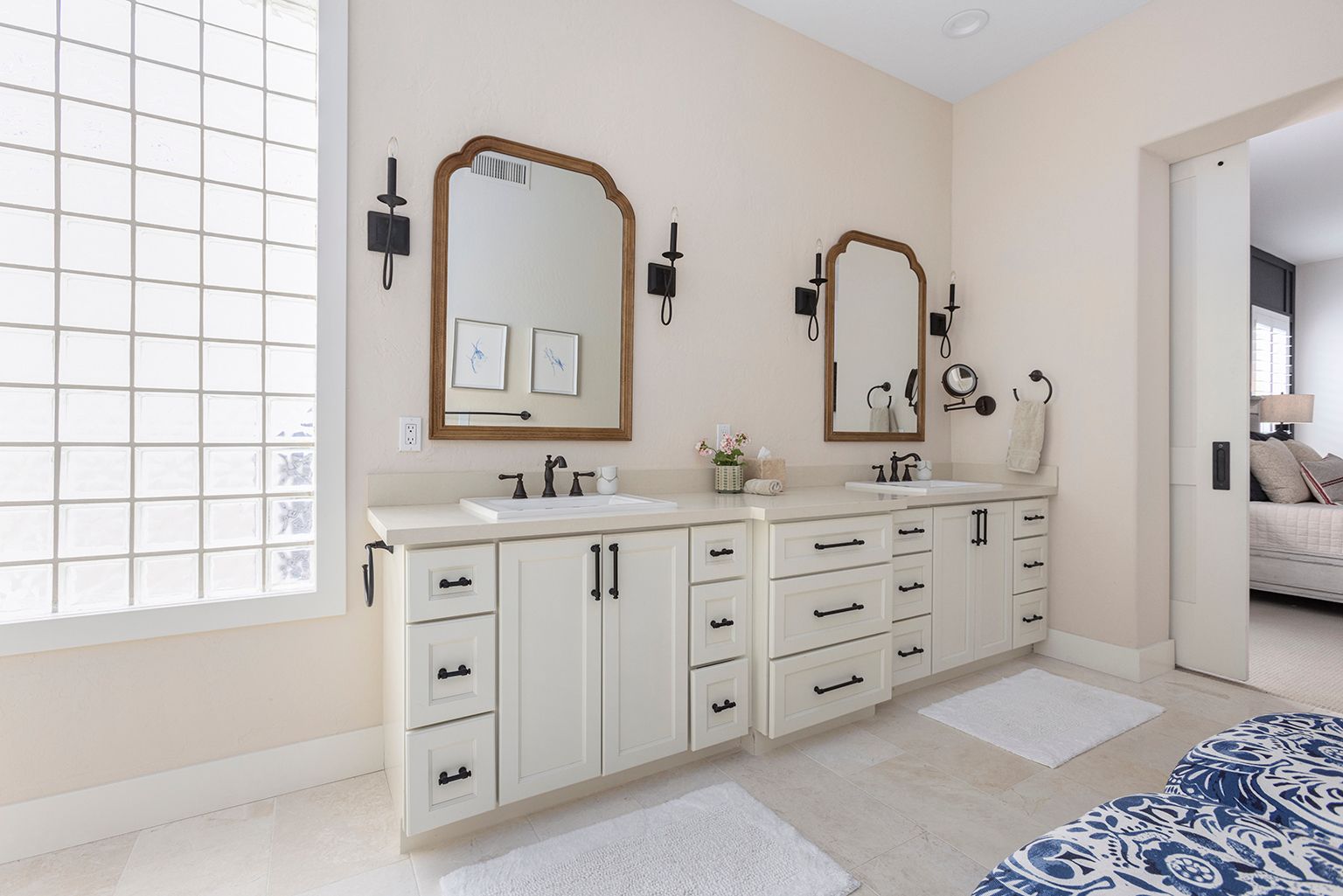 A bathroom with two sinks and two mirrors.