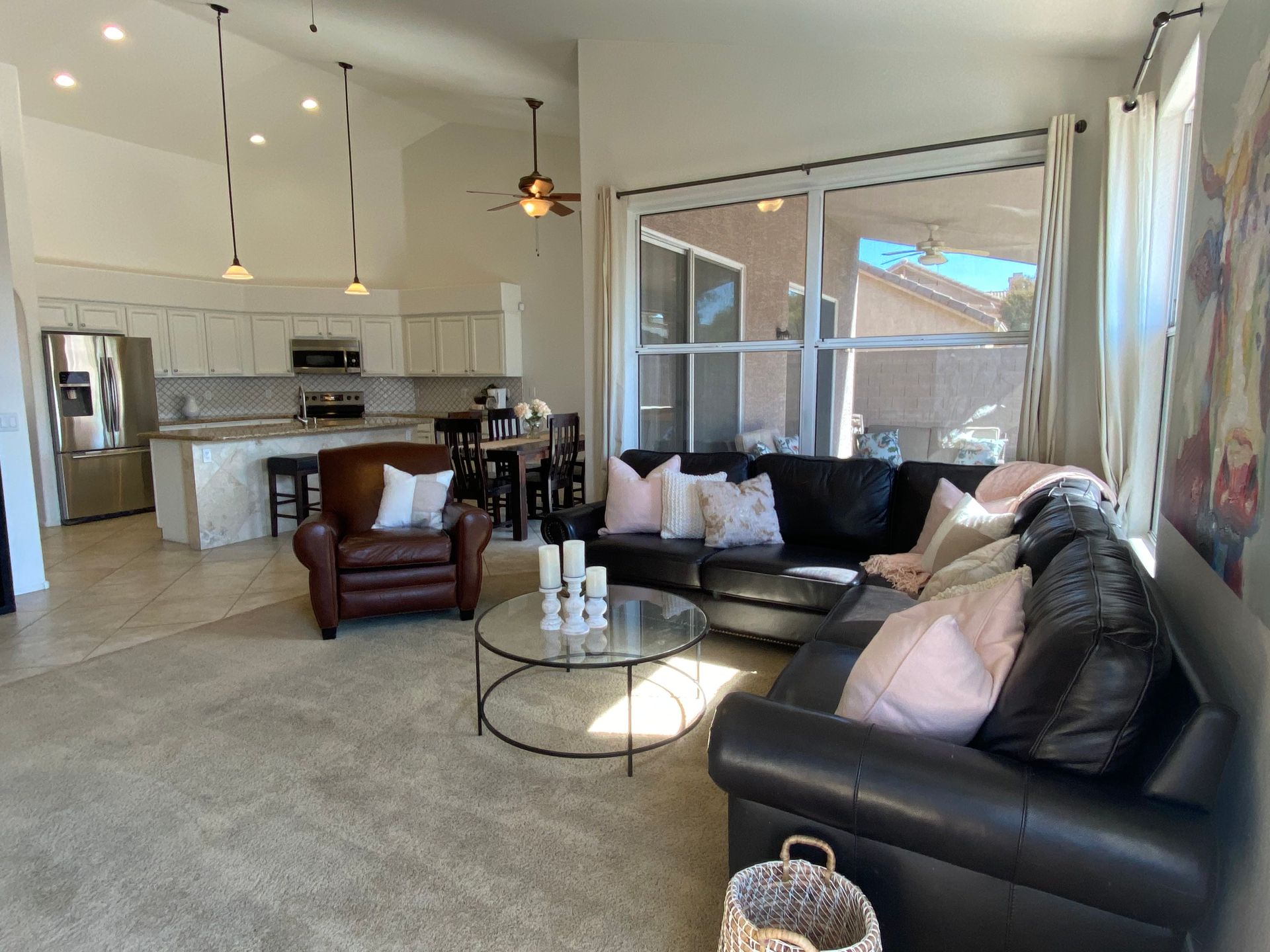 A living room with a couch , chair , and coffee table.