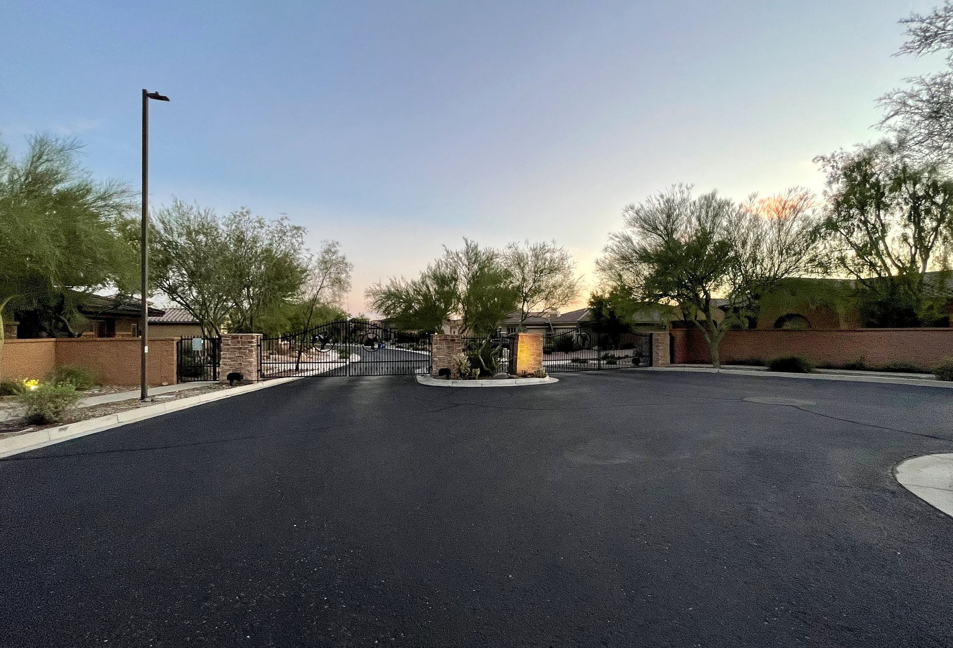 There is a gate in the middle of the road.