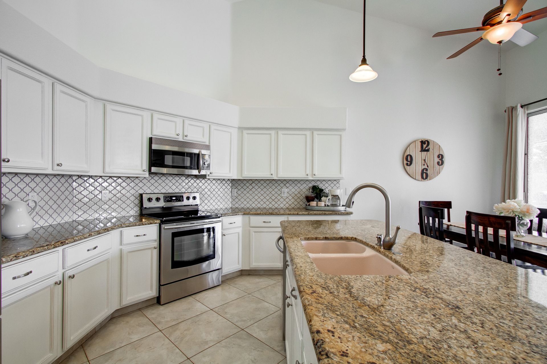 A kitchen with stainless steel appliances and granite counter tops