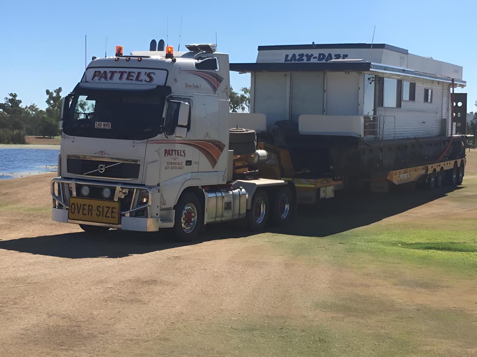 A White Truck With The Word Pattels On The Side — Pattel's Heavy Haulage Townsville Pty Ltd In Garbutt, QLD