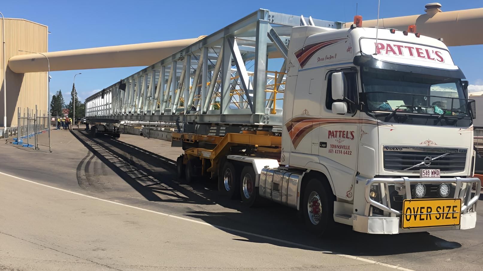 A Large Truck Is Carrying A Bridge On A Trailer — Pattel's Heavy Haulage Townsville Pty Ltd In Garbutt, QLD