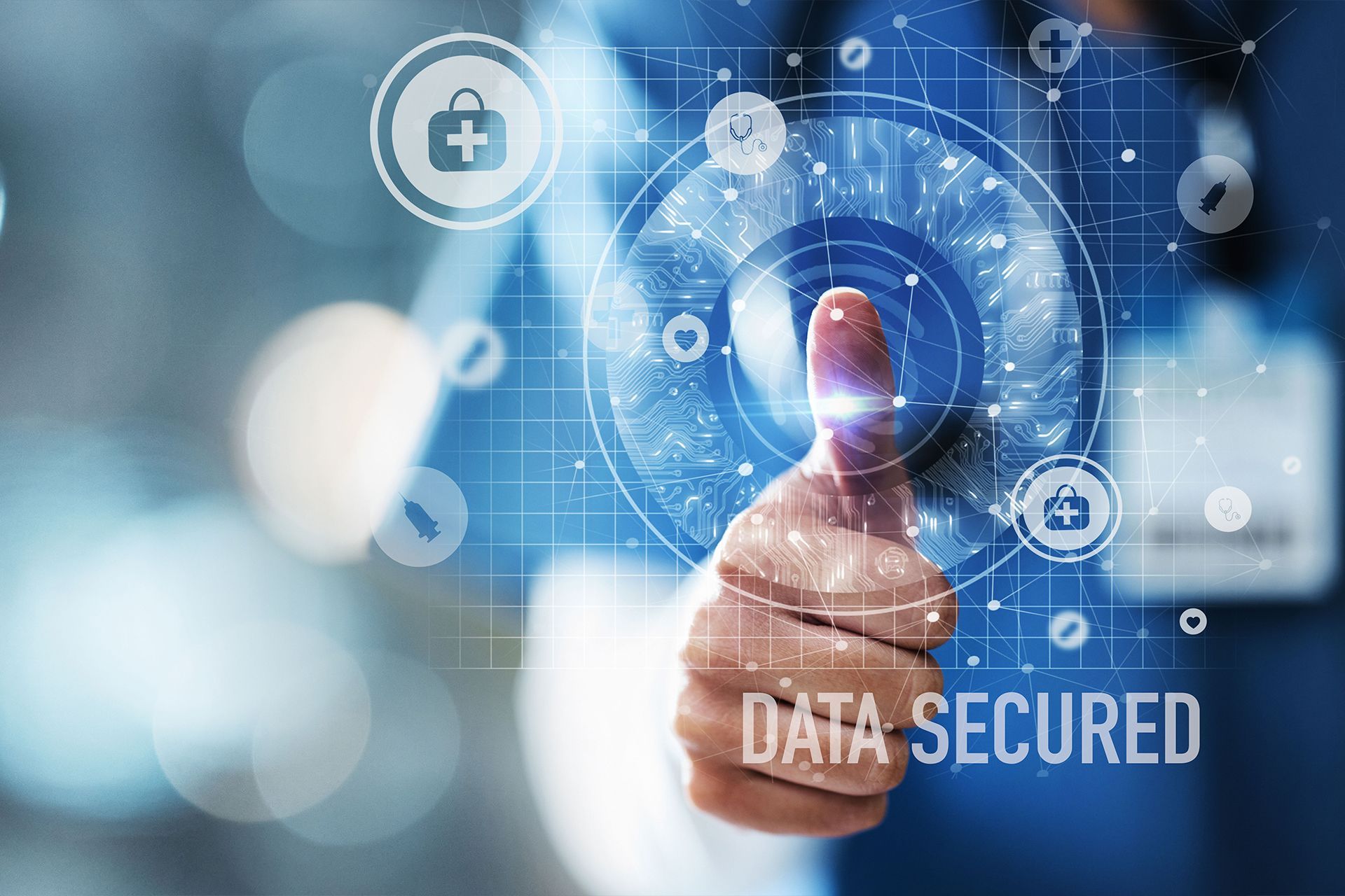 Image depicting healthcare professionals using enhanced cybersecurity and data privacy measures to protect patient information.