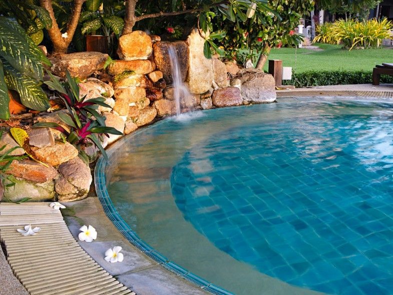 A Swimming Pool With a Waterfall in the Background — Fannie Bay Pool Shop in Woolner, NT