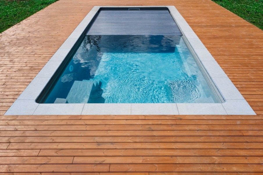 A Swimming Pool is Surrounded by a Wooden Deck — Fannie Bay Pool Shop in The Narrows, NT