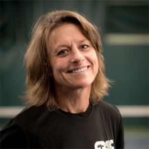 A woman wearing a black shirt with the word gps on it