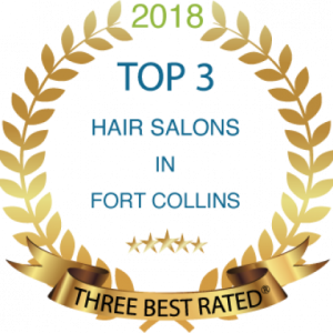 Gold award emblem for 2018 Three Best Rated Hair Salons in Fort Collins, surrounded by a laurel wreath.