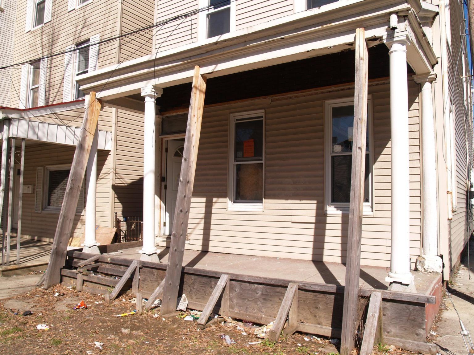 A house with a porch that is being demolished