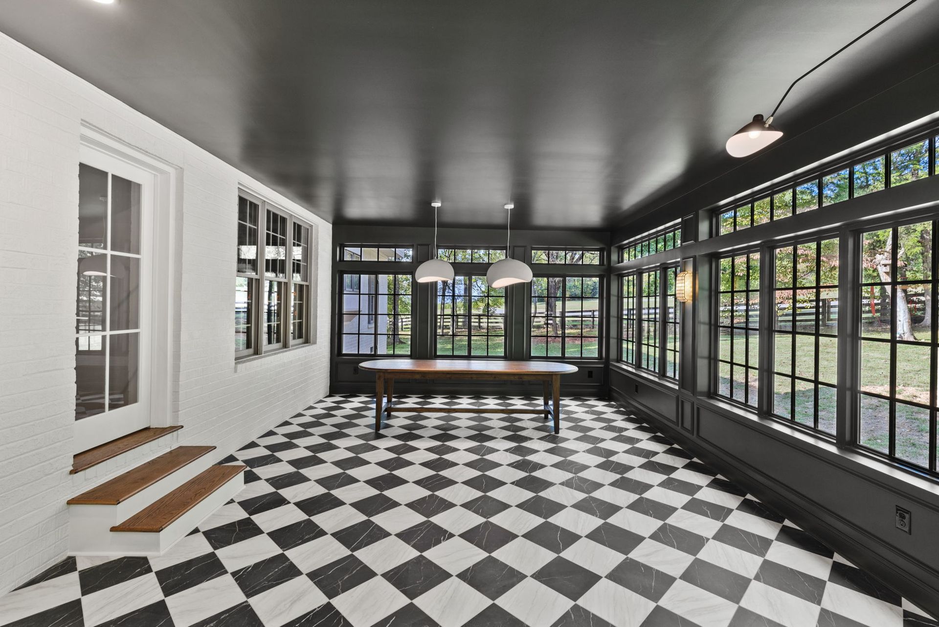 A room with a checkered floor and a pool table.