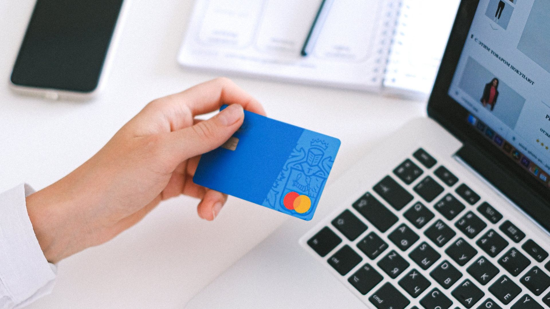 Hand holding a credit card
