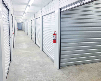 Interior hallway of climate-controlled storage units at Premier Storage & Shipping in Addis, LA