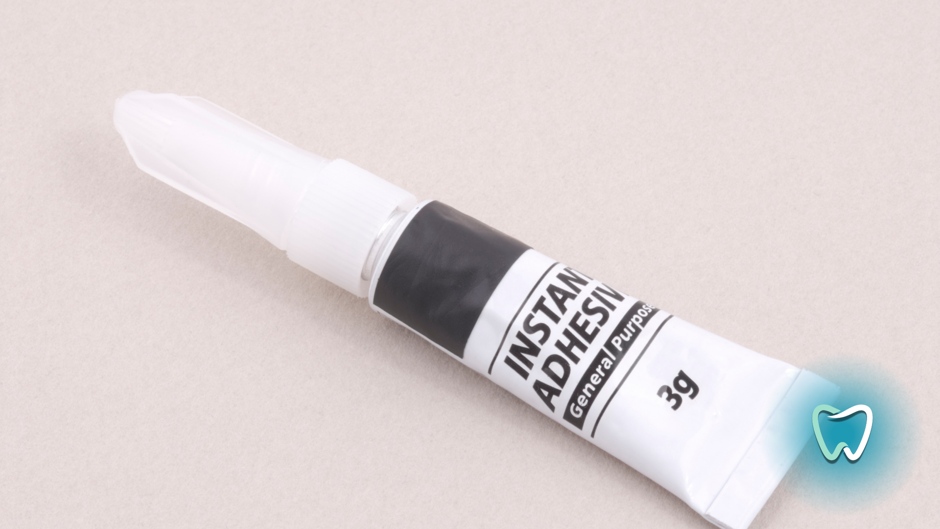 A tube of instant adhesive is sitting on a table