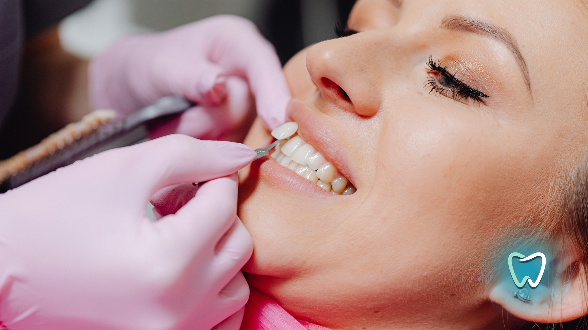 A woman is getting her teeth examined by a dentist.
