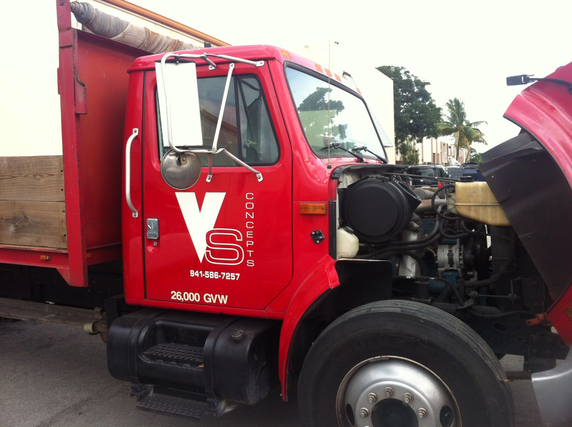 A red truck with a white v on the side