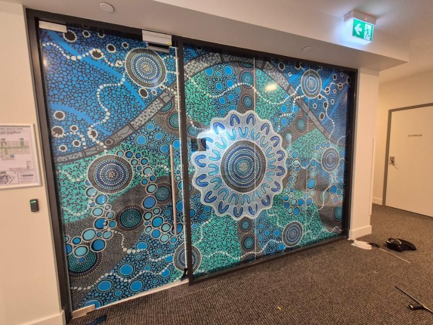 A Door With a Painting on It in a Hallway — Signworld In Mitchell, ACT