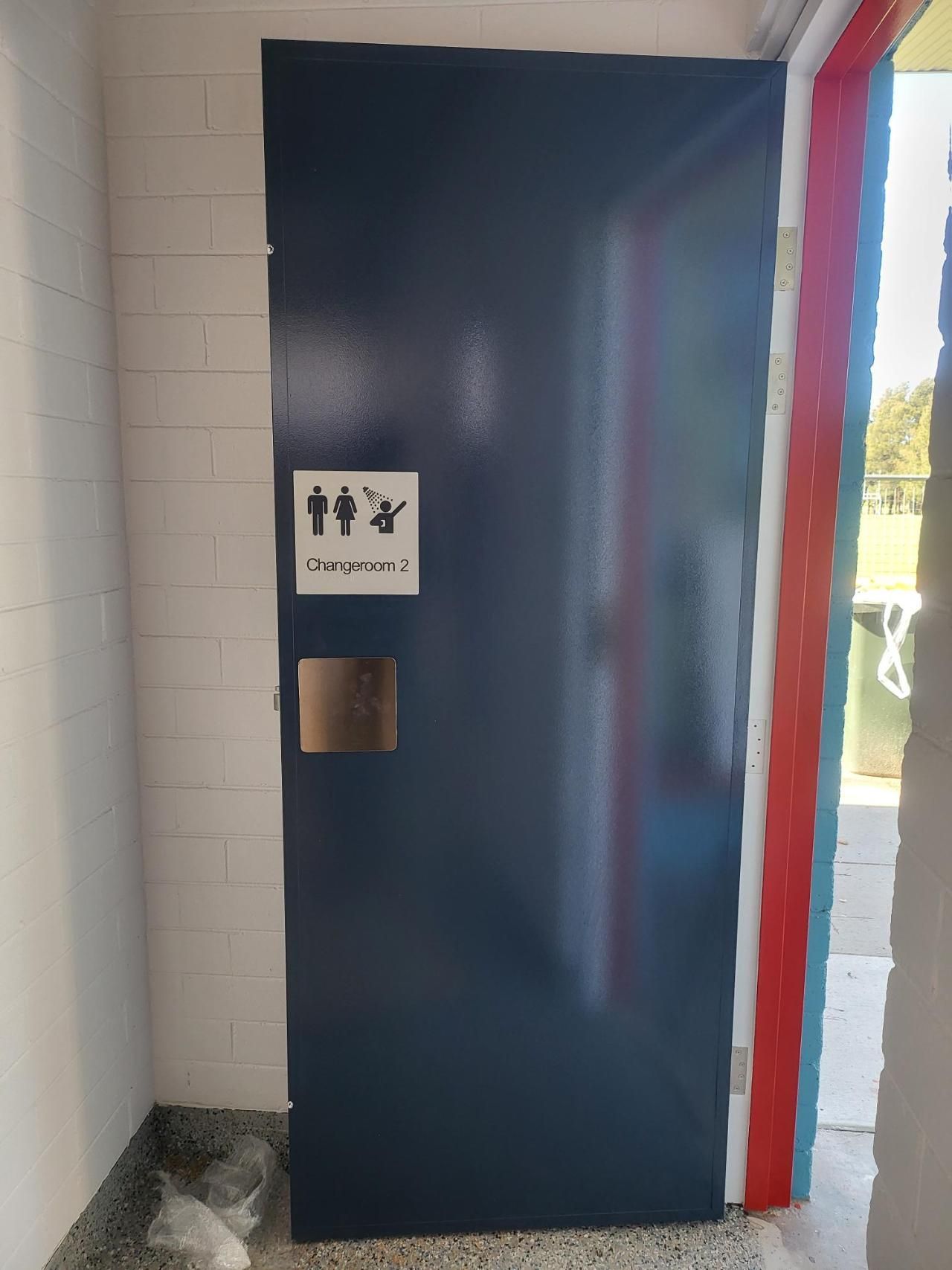 A Blue Door With a Sign on It That Says Toilets — Signworld In Mitchell, ACT