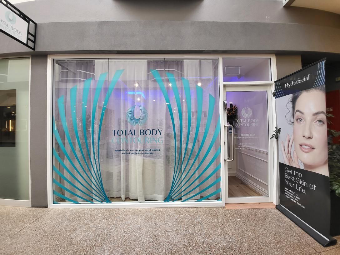 The Front of a Beauty Salon With a Woman 's Face on the Window — Signworld In Mitchell, ACT