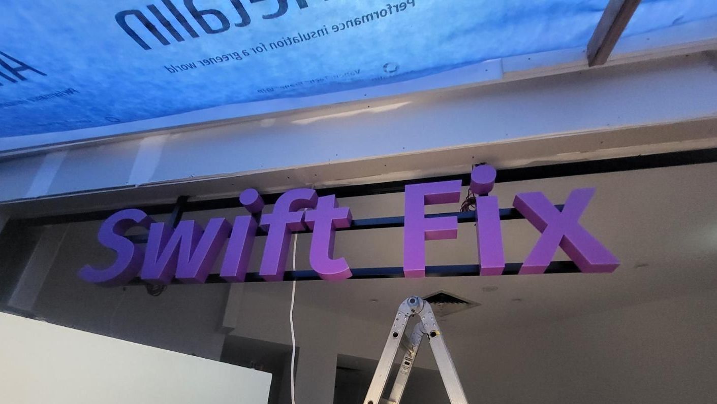 A Purple Sign That Says Swift Fix on It — Signworld In Mitchell, ACT