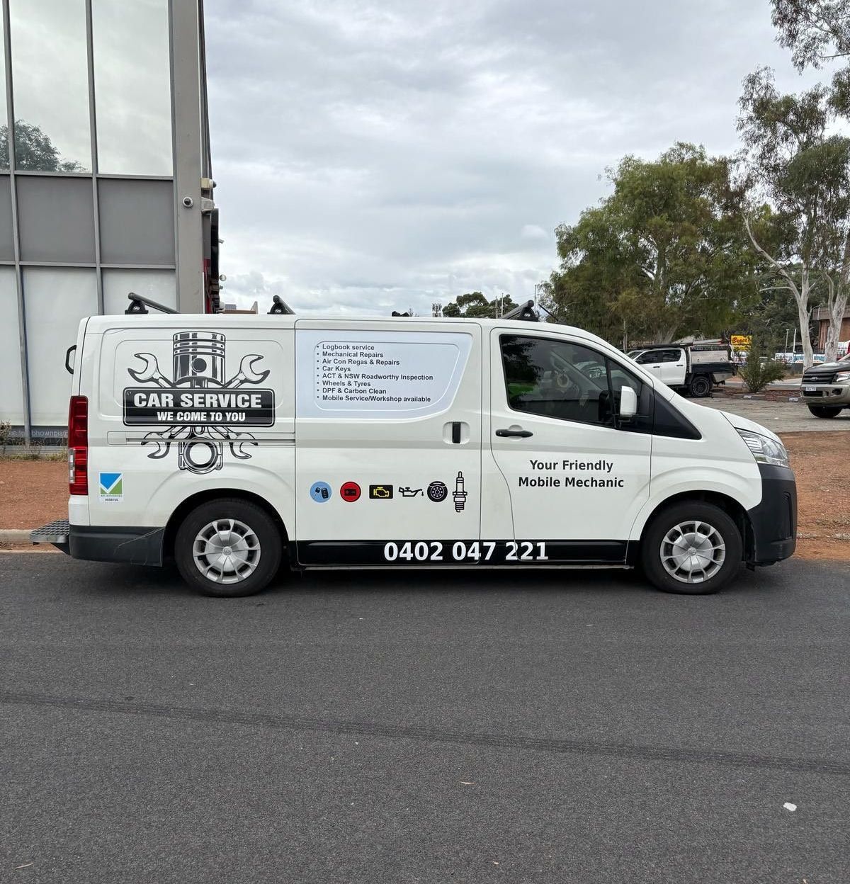 A car service van is parked on the side of the road — Signworld In Mitchell, ACT