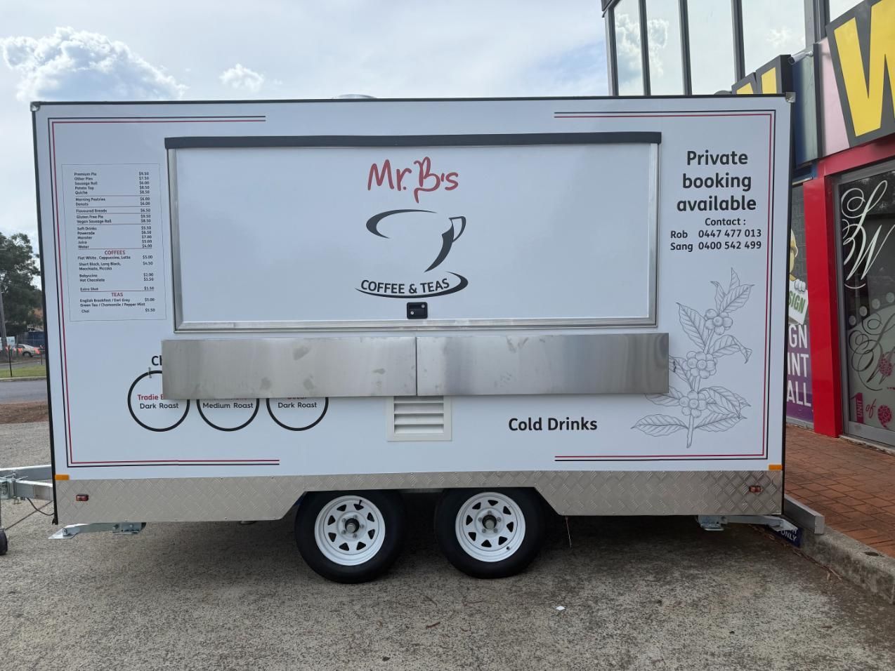 A White Food Truck is Parked in a Parking Lot — Signworld In Mitchell, ACT