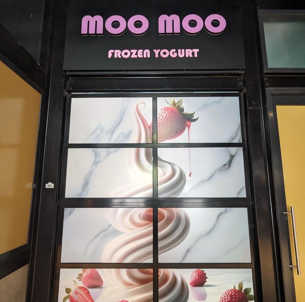 A Store Front With a Sign That Says Moo Moo Frozen Yogurt — Signworld In Mitchell, ACT