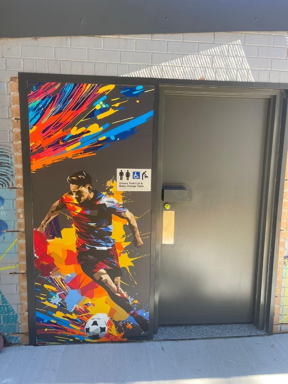A Door With a Painting of a Soccer Player on It — Signworld In Mitchell, ACT