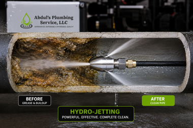 Hydro-jetting a clogged pipe: left side dirty, right side clean with spray nozzle inside pipe