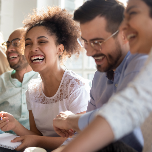 Group of people smiling and laughing