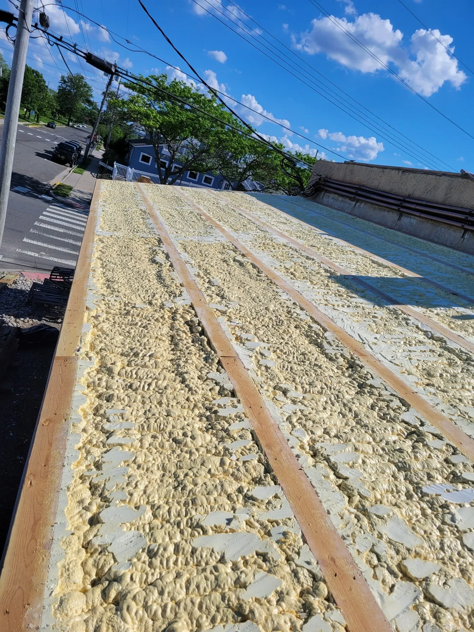 There is a lot of foam on the roof of a building.